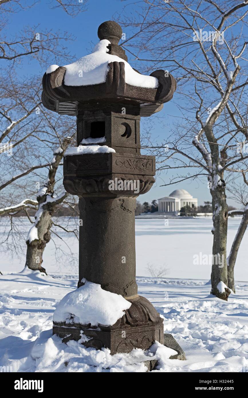 A Japanese lantern statue sits across the Tidal Basin from the