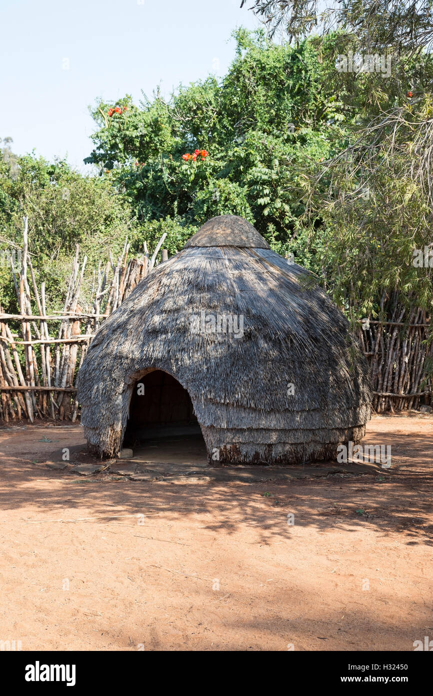 Traditional Zulu hut in a stockade in the KwaZulu-Natal region of South Africa Stock Photo