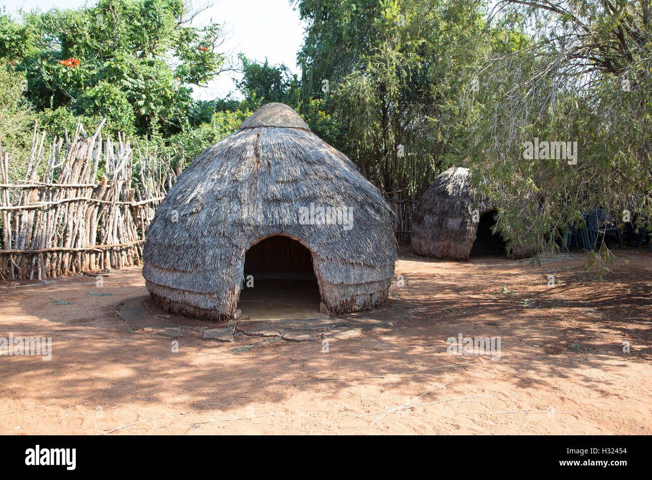 Traditional Zulu huts in a stockade in the KwaZulu-Natal region of South Africa Stock Photo