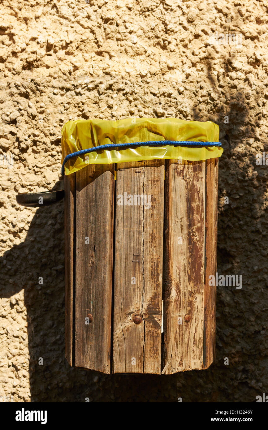 wood, plastic-lined trash bin an Italian, Alpine village Stock Photo