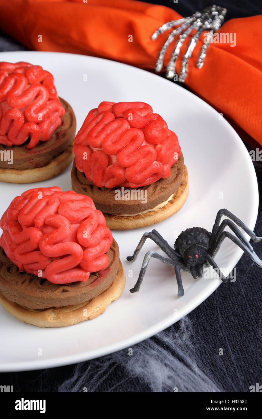 bloody brains out on the marzipan cookie sandwich on Halloween Stock Photo