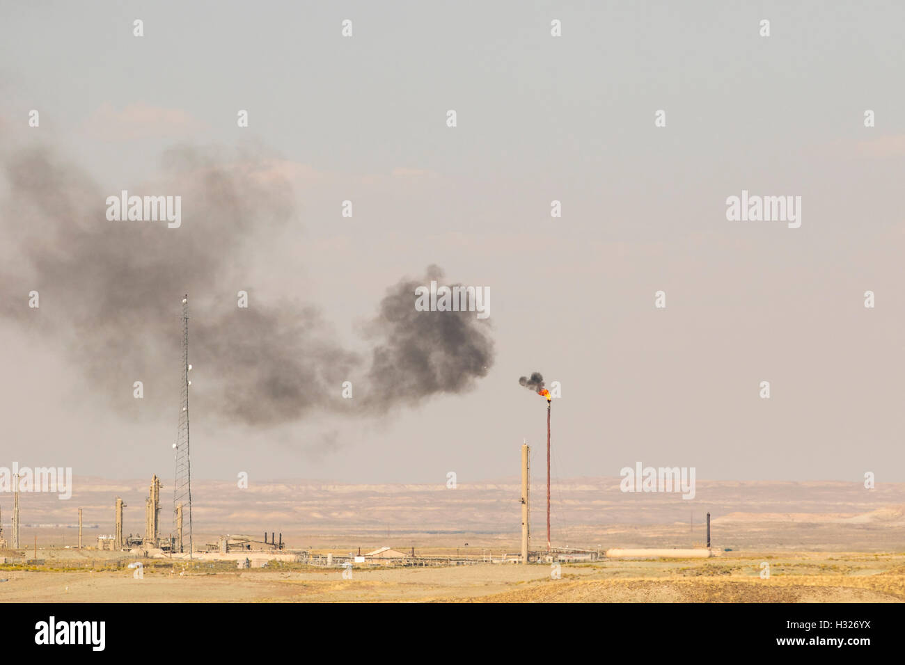 Climate change and global warming caused by air pollution from smoke stack. Stock Photo
