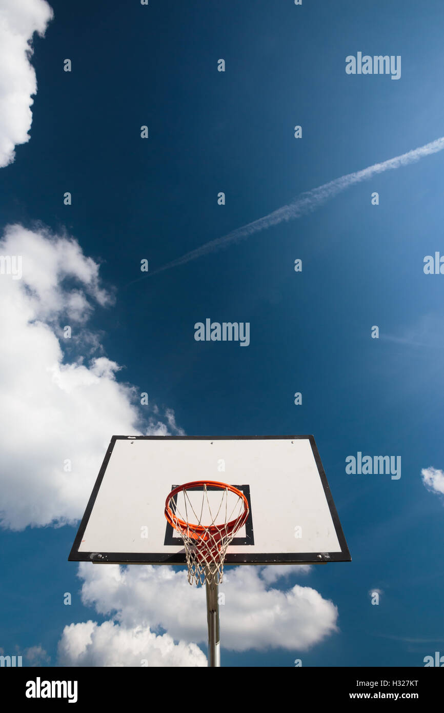 Basketball hoop against lovely blue summer sky Stock Photo Alamy