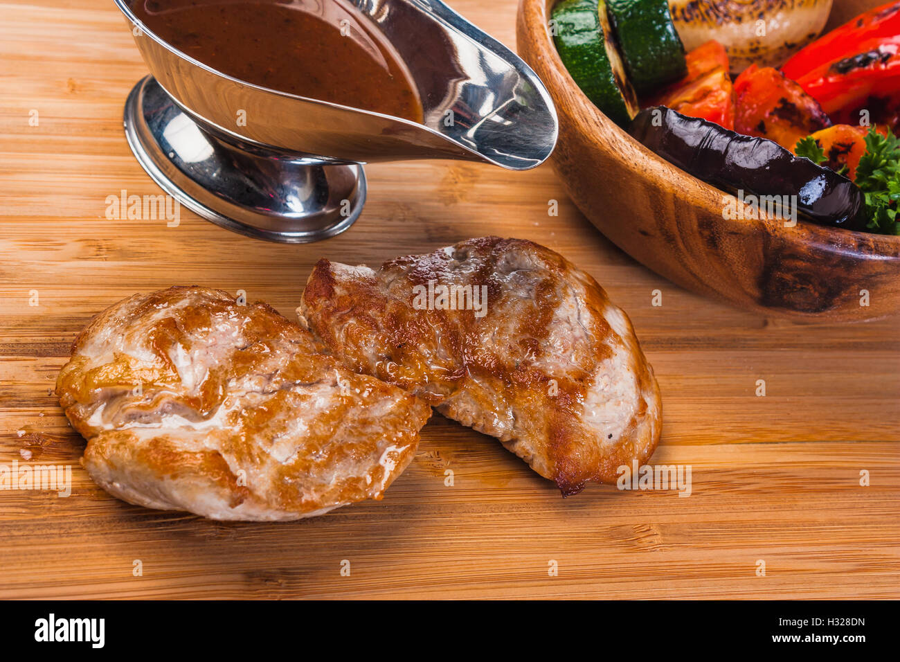 Grilled pork with baked vegetables Stock Photo