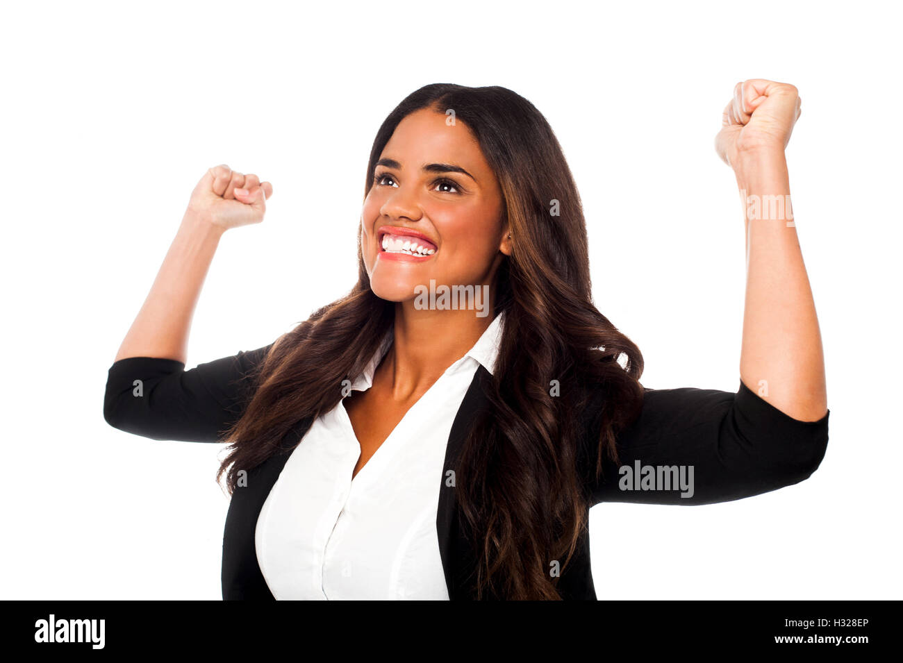 Excited woman with arms raised Stock Photo - Alamy
