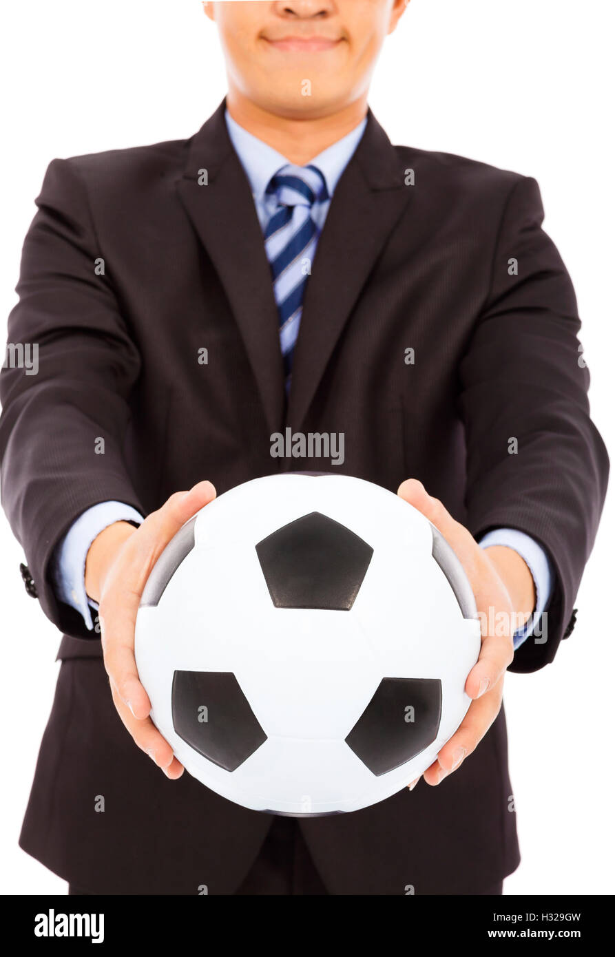 smiling businessman show a soccer Stock Photo - Alamy