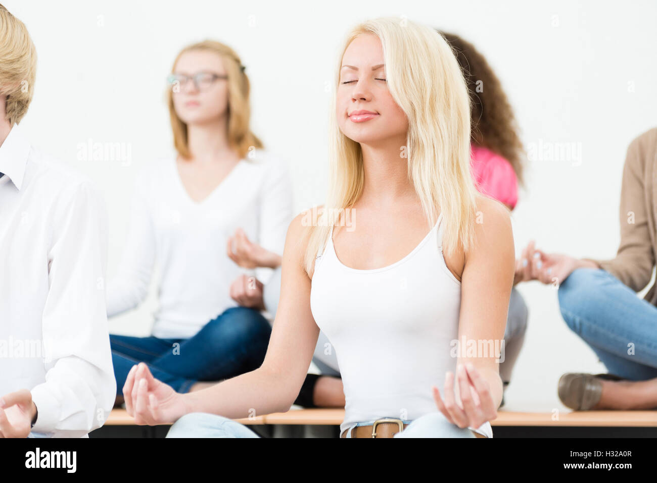 young woman, meditating with closed eyes Stock Photo Alamy