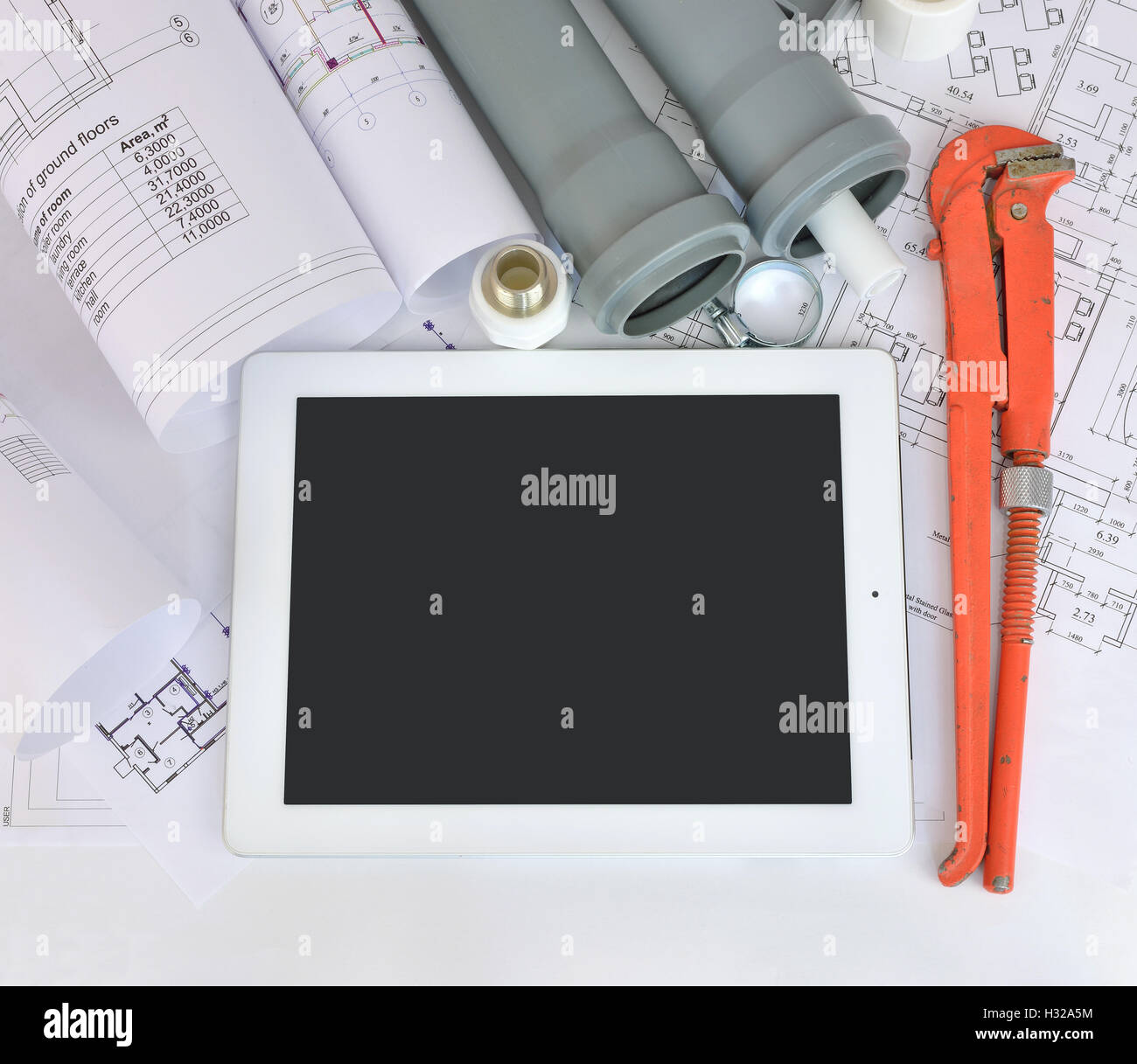 Plumbing tools on the construction drawings Stock Photo - Alamy