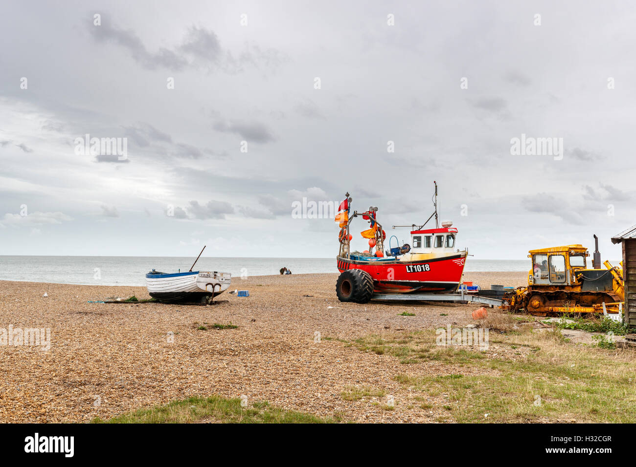 East Anglian landscape fishing boat on trailer pulled by a Caterpillar
