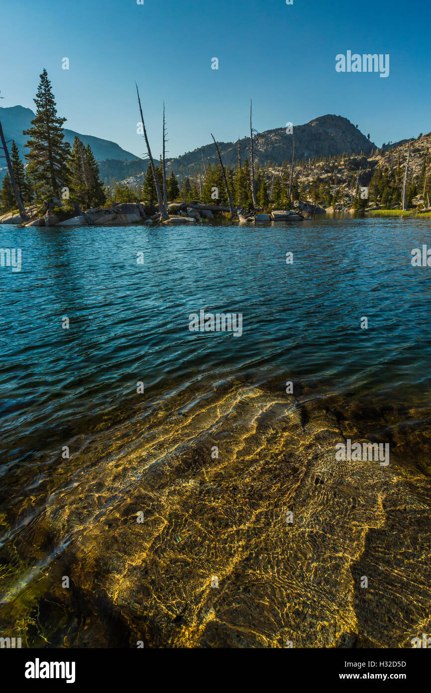 Water and granite at the shore at Ropi Lake in the Desolation Wilderness, Eldorado National Forest, California, USA Stock Photo