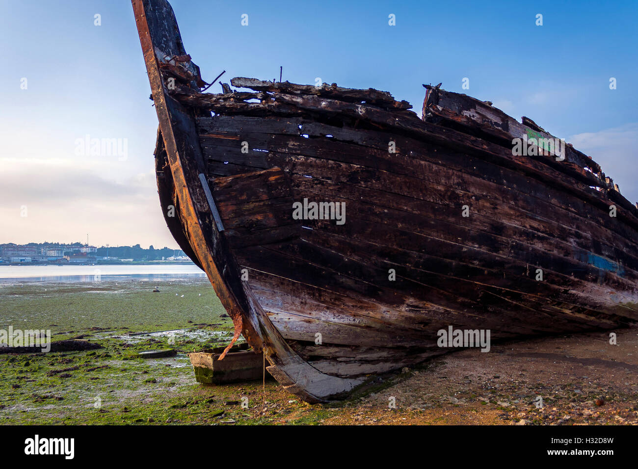Old wood boat on the beach Stock Photo