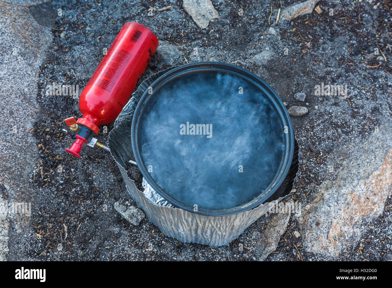Breakfast water boiling in a gasoline-fueled MSR stove in the ...