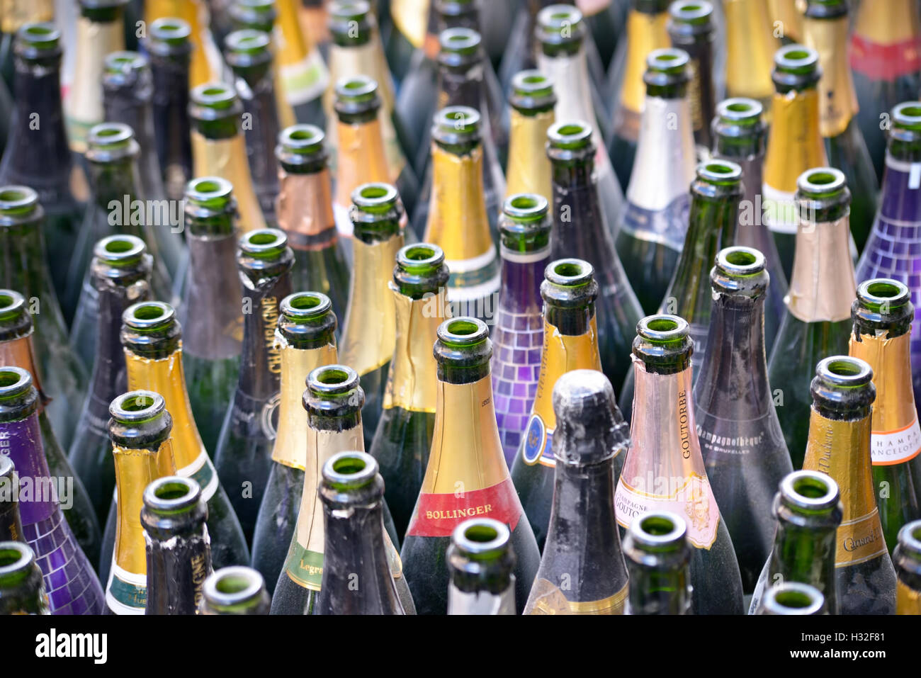 Empty wine bottles prepared for collection by cleaning service on street of Brussels, Belgium on