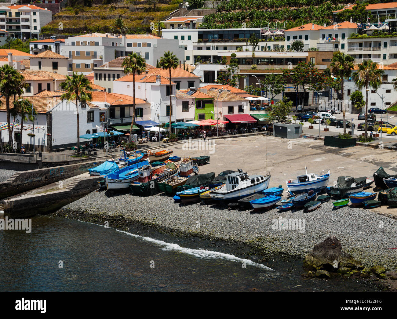 Colourful boats lie on the beach of Camara de Lobos on the Portuguese island of Madeira Stock Photo