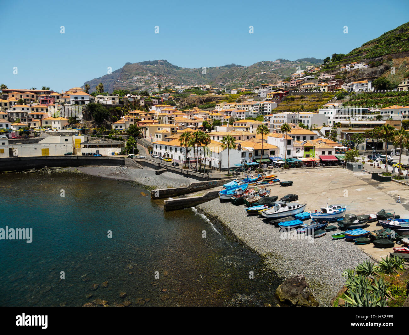 Colourful boats lie on the beach of Camara de Lobos on the Portuguese island of Madeira Stock Photo