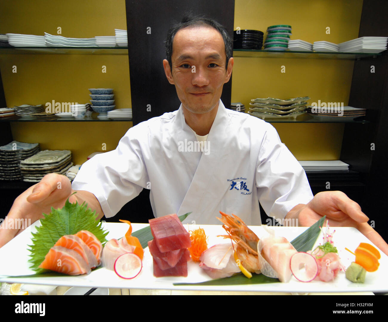 Matsuri Festival 2014 - The famous Japanese chef Osamu Ikeda, engaged in the preparation of a plate of sashimi. Milan, Italy, Ma Stock Photo