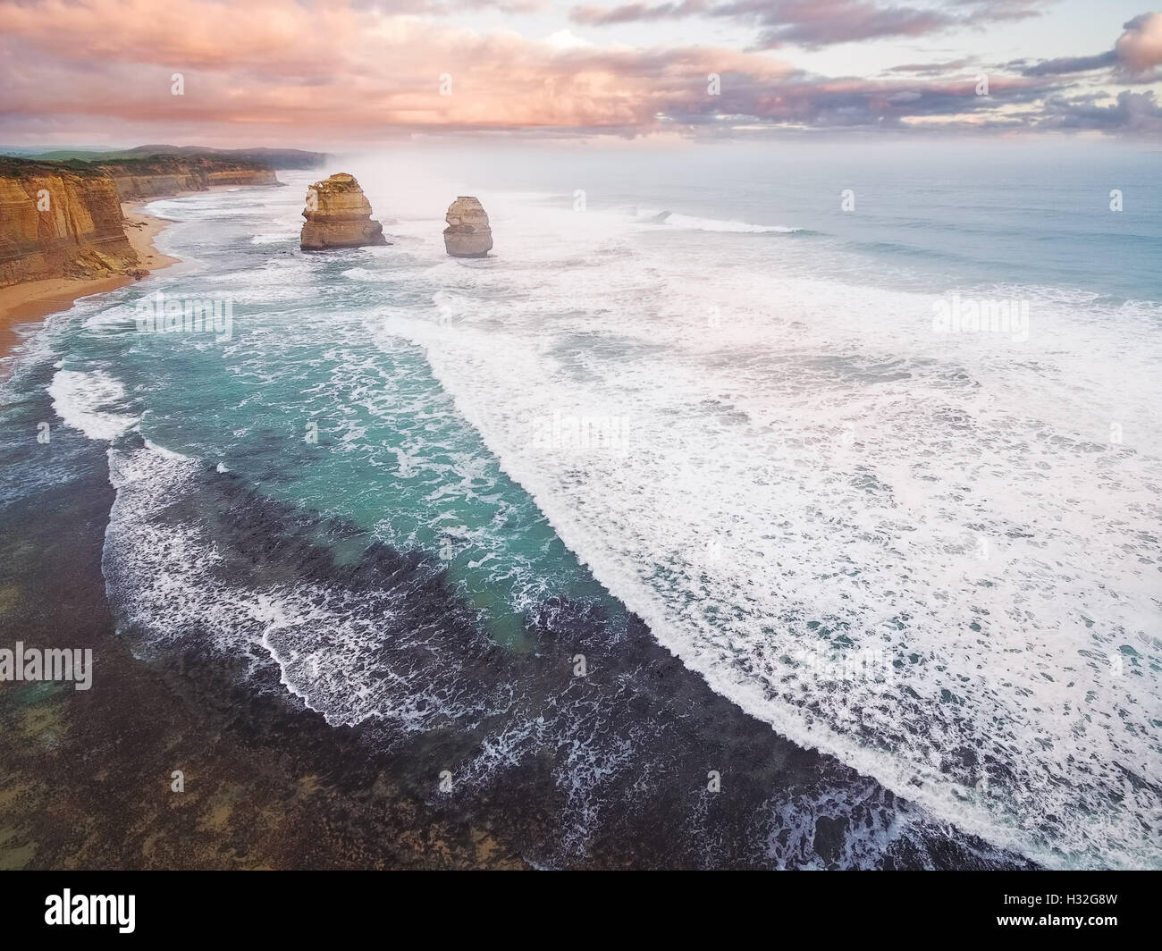 Aerial view of the Gog and Magog rock formations at sunset with breaking ocean waves Stock Photo