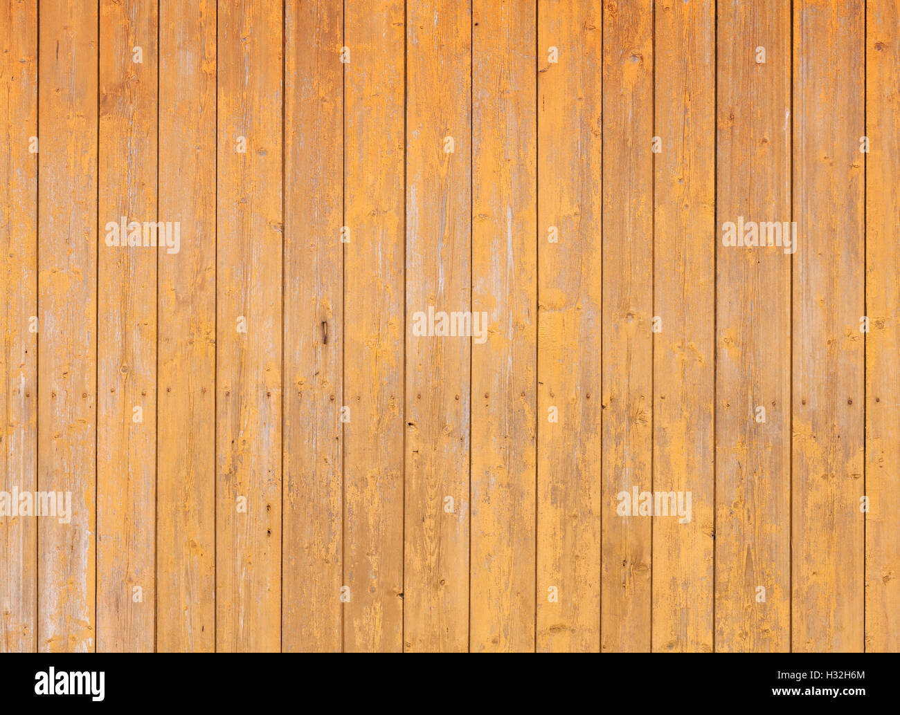 Wooden wall with yellow paint layer, detailed background photo texture Stock Photo