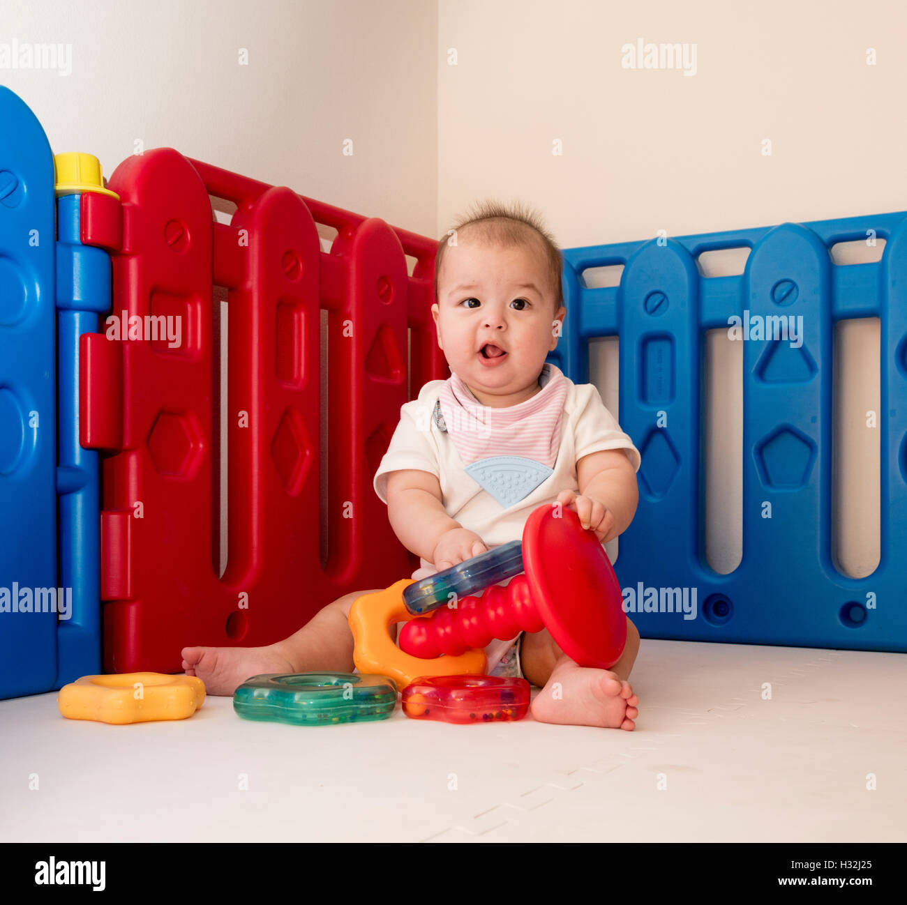 baby playing with stacking ring toy Stock Photo Alamy