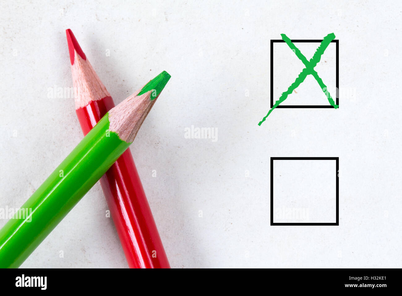 Green and red pencils with marking checkbox. Concept for customer satisfaction survey,education research or election Stock Photo