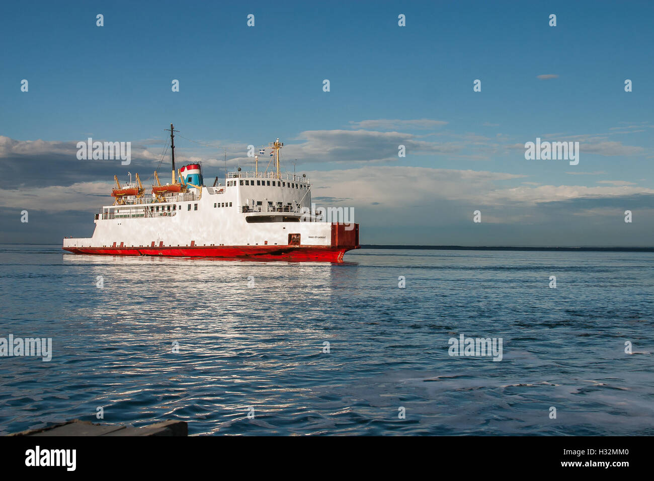 A white vessel on the Saint Laurence river. Stock Photo
