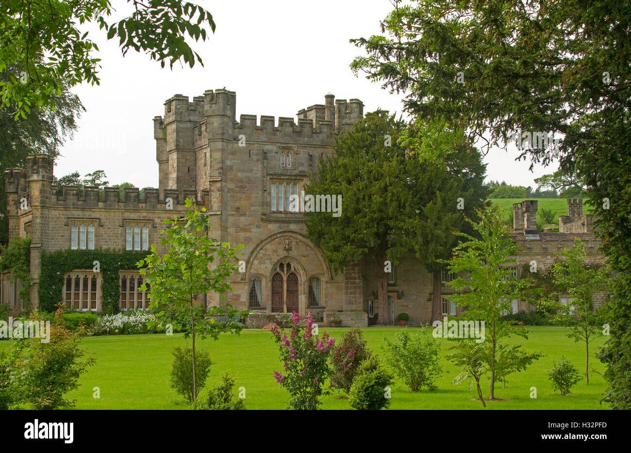 Bolton Hall, grand 17th century British stately home with extensive gardens & lawns  hemmed by trees at Bolton Abbey Yorkshire England Stock Photo