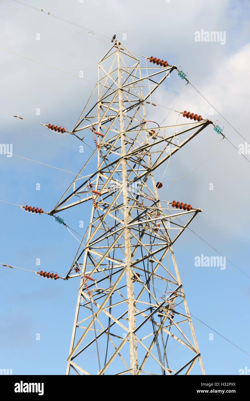 High voltage electricity pylon against a cloudy sky Stock Photo - Alamy