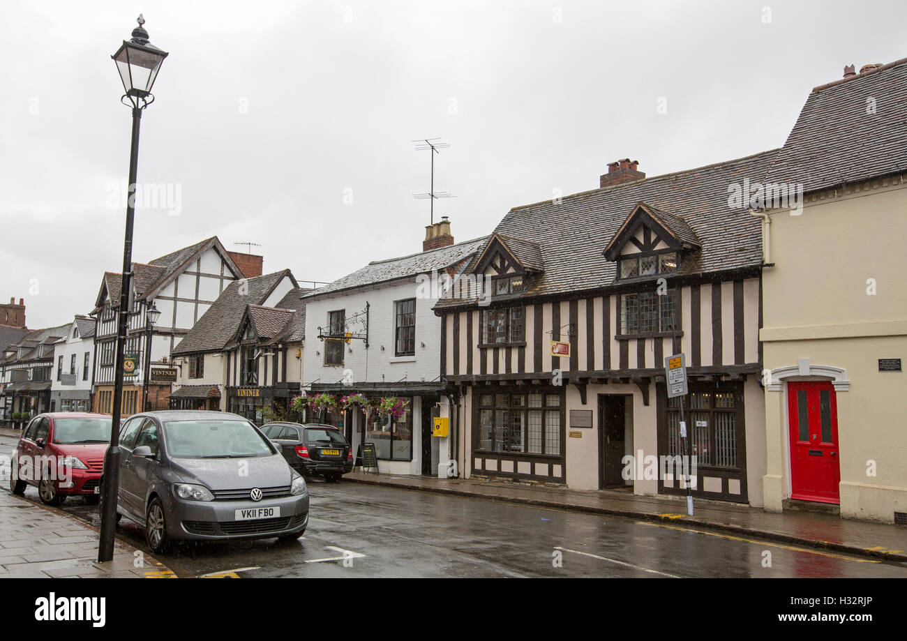 Historic buildings in main street of Stratford-upon-Avon, Warwickshire, England on rainy day Stock Photo