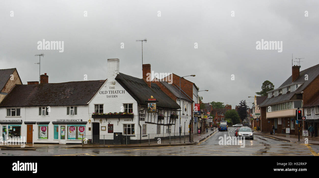 Panoramic view of 15th century Old Thatch Tavern & street on rainy day in Stratford-upon-Avon, Warwickshire, England Stock Photo