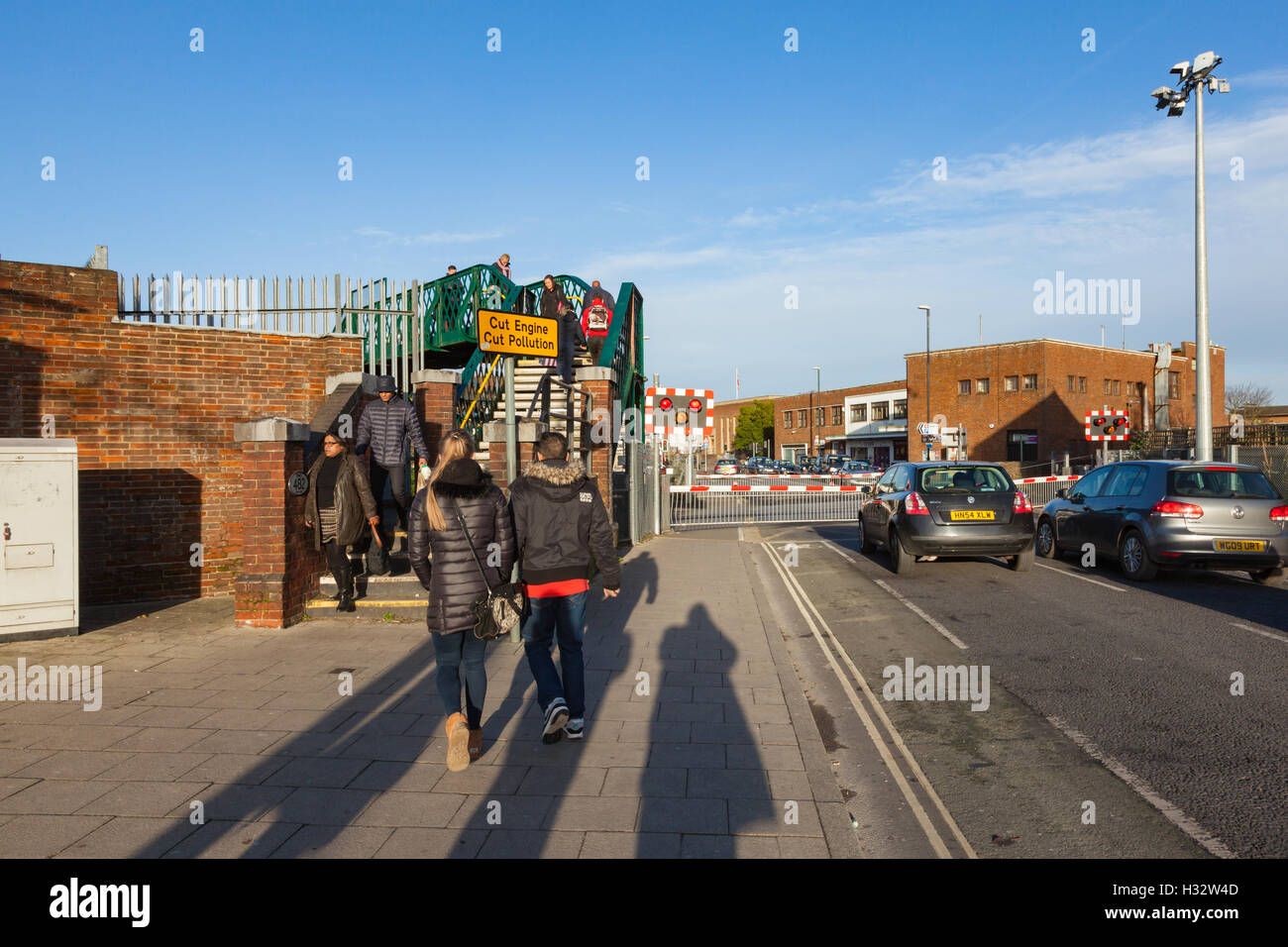 Pedestrians use the footbridge at Chichester Station to bypass the