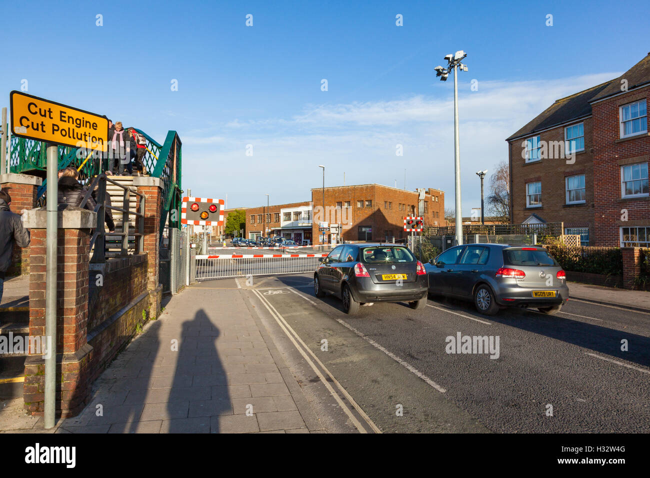 Pedestrians use the footbridge at Chichester Station to bypass the