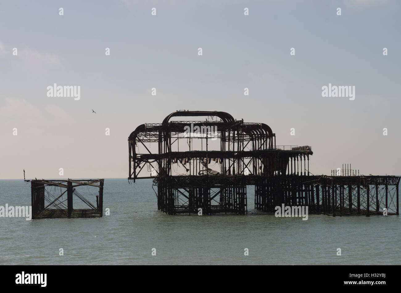 silhouetted burnt shell of Brighton West Pier designed by Eugenius Birch that burned down in 2003 Stock Photo