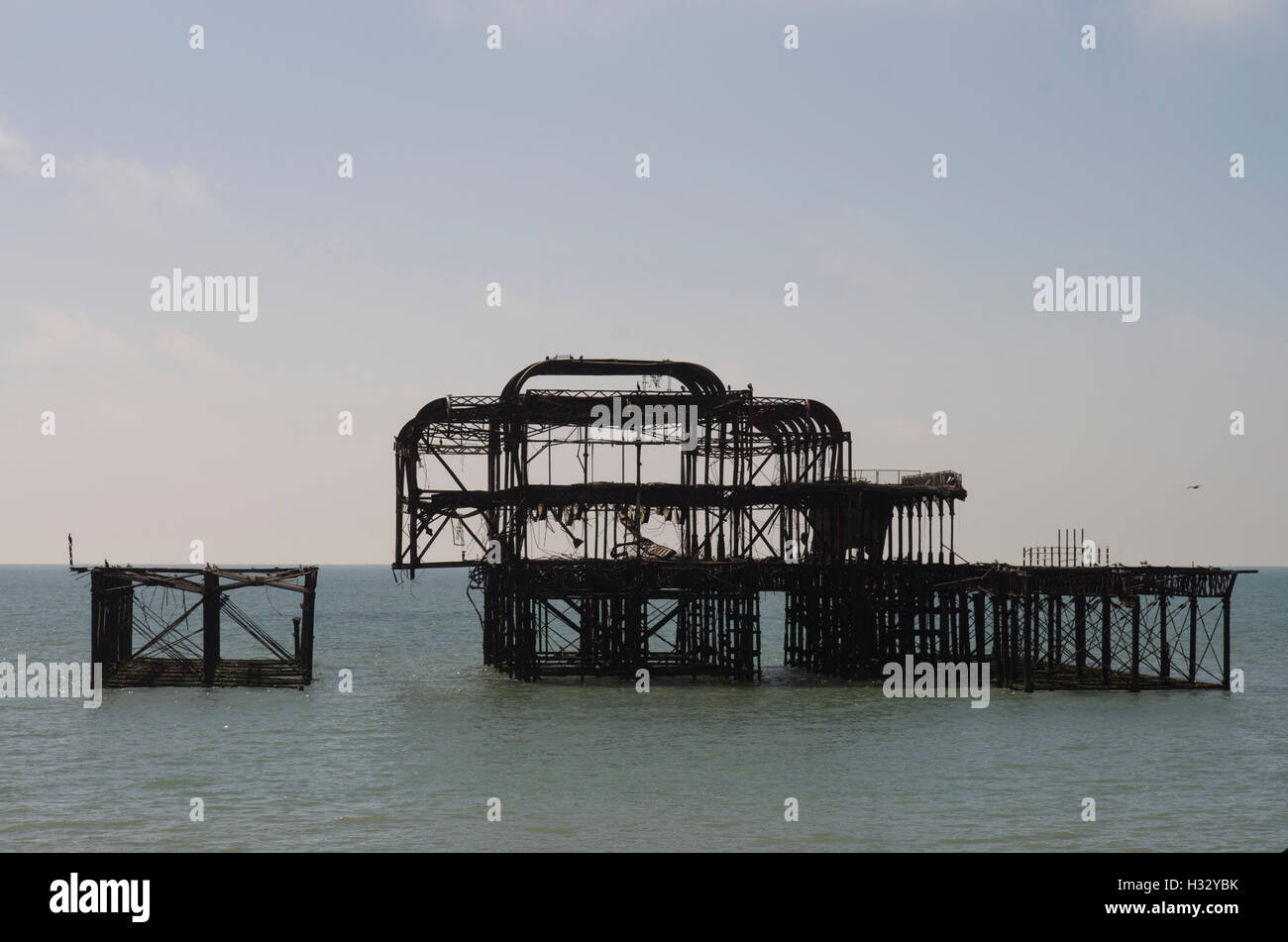 silhouetted burnt shell of Brighton West Pier designed by Eugenius Birch that burned down in 2003 Stock Photo