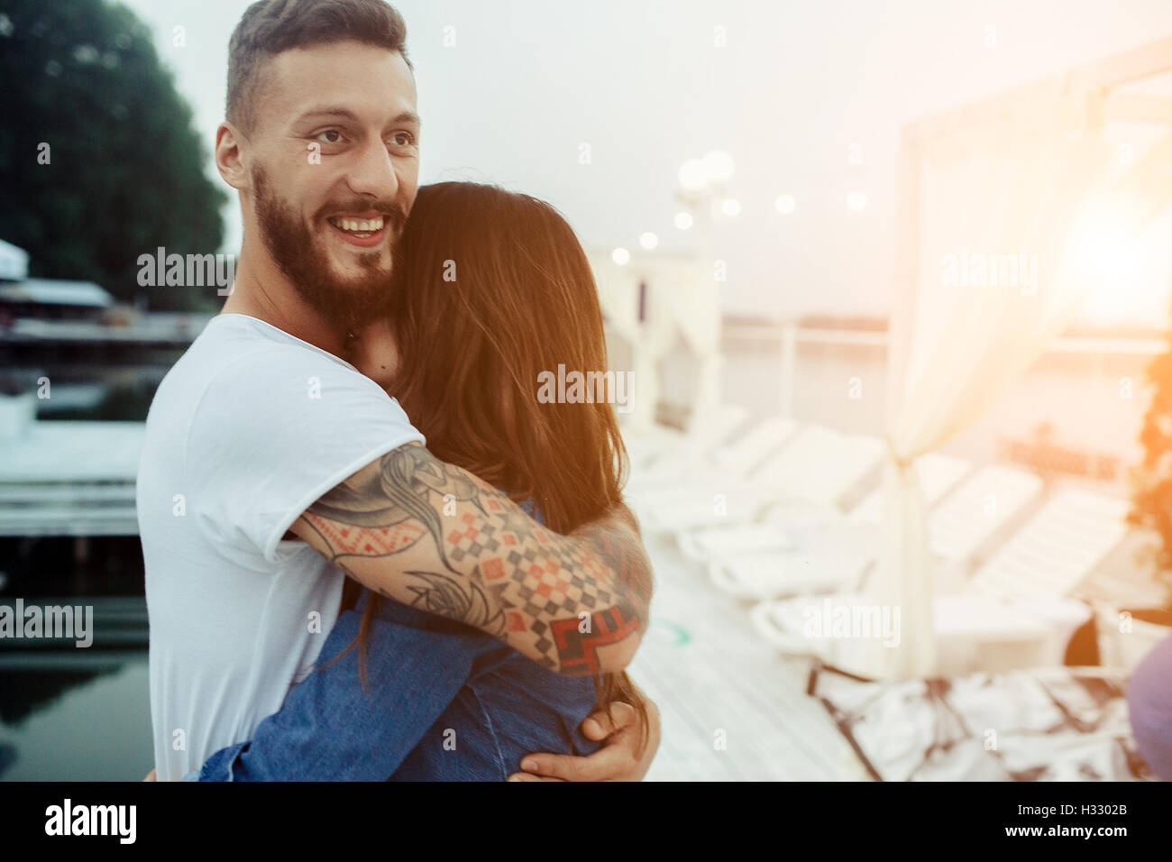 guy hugging his woman Stock Photo - Alamy