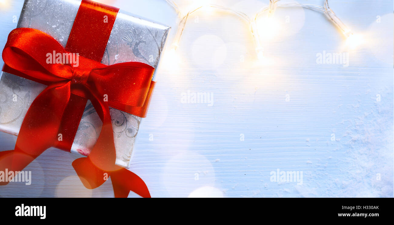 Christmas card background; gift box and Christmas light Stock Photo