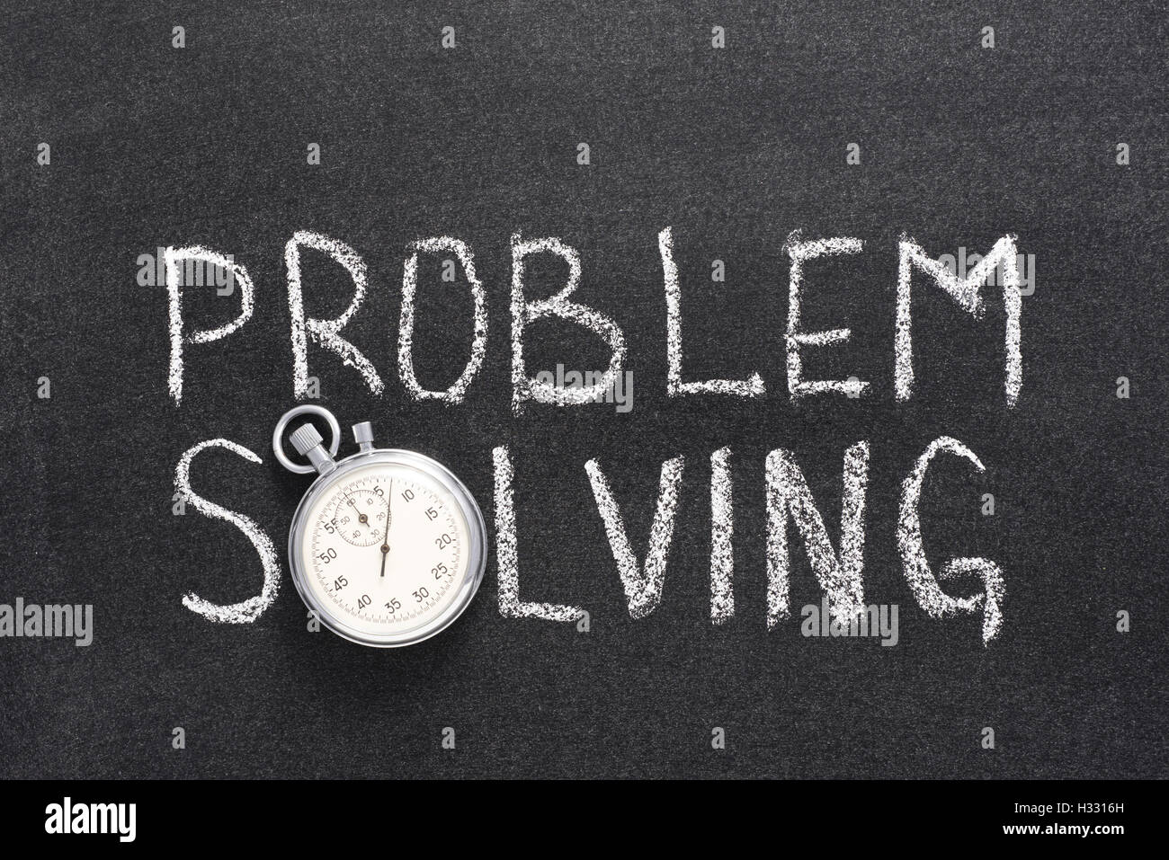 problem solving phrase handwritten on chalkboard with vintage precise stopwatch used instead of O Stock Photo