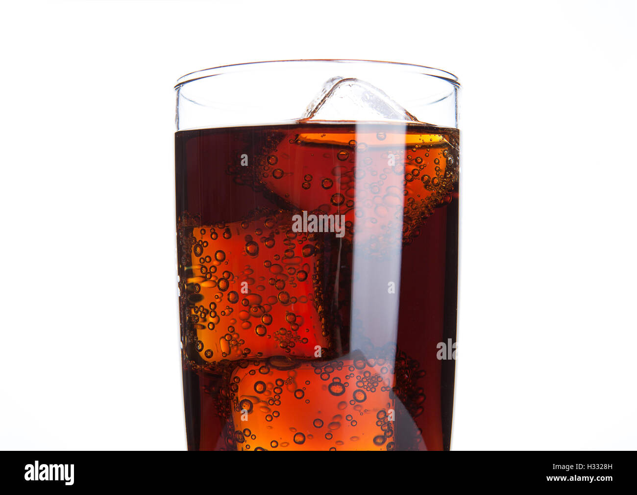 Cola glass with ice cubes and bubbles on white background Stock Photo ...