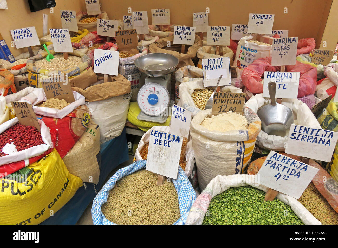 Bags with flour, maize and others at the market in Celendin, Peru, South America. Stock Photo