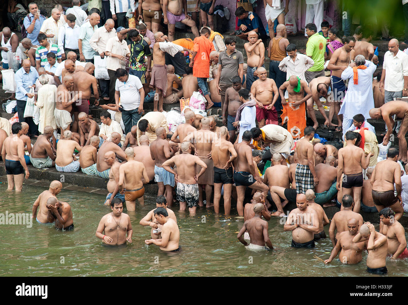 The image of men praying to ancestors banganga walkeshwar mumbai maharashtra india Stock Photo