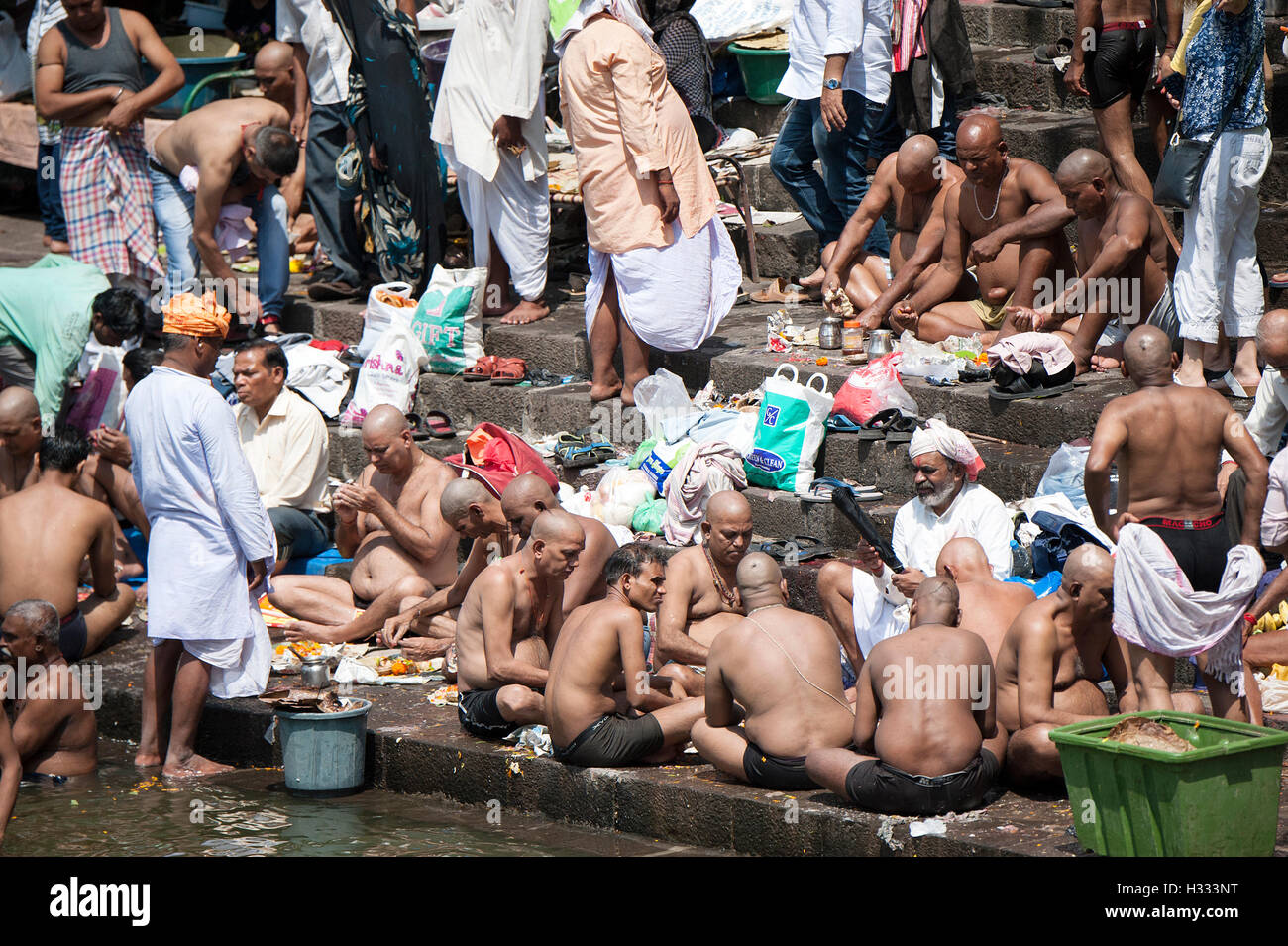 The image of men praying to ancestors banganga walkeshwar mumbai maharashtra india Stock Photo