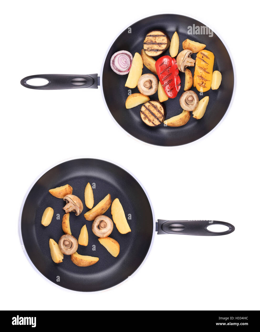Two frying pans with vegetables Stock Photo - Alamy