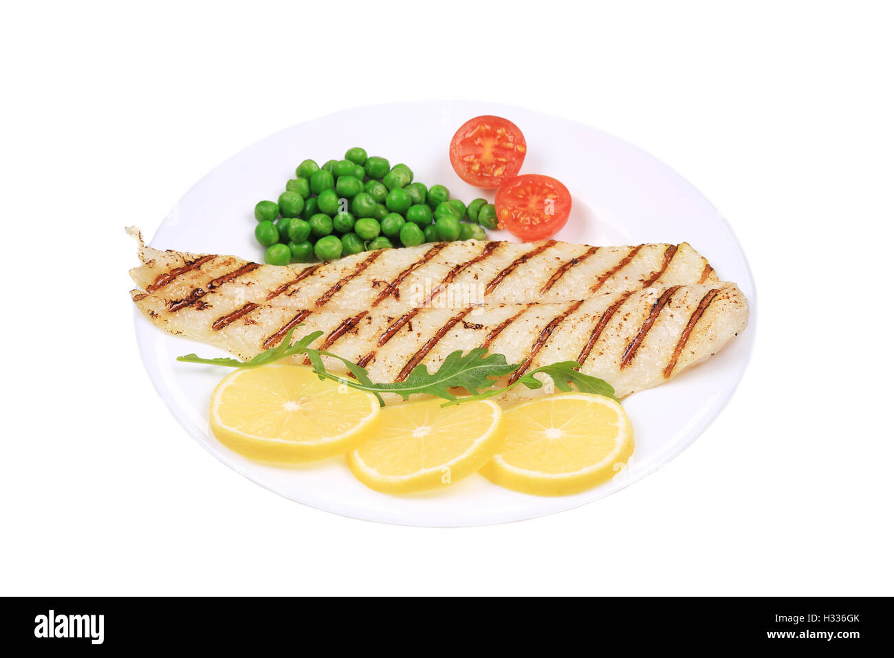 Fish fillet with vegetables Stock Photo - Alamy
