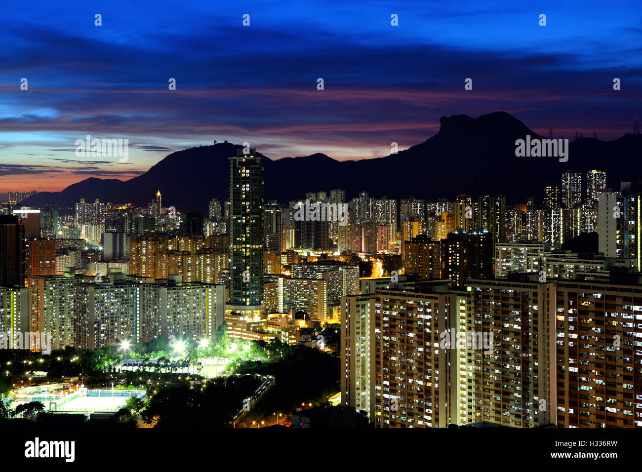 Kowloon cityscape in Kong Kong with lion rock mountain Stock Photo - Alamy