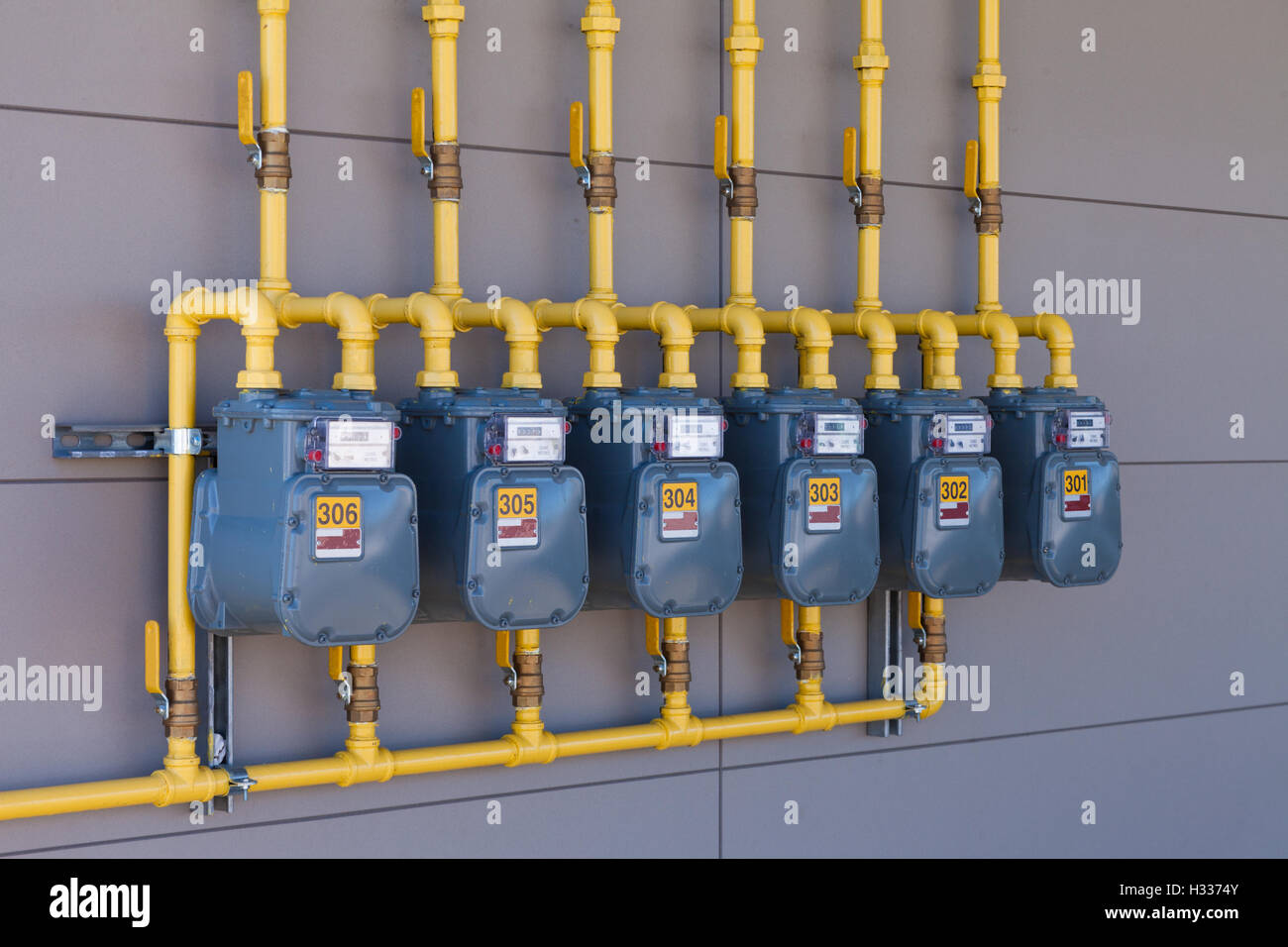 Residential gas energy meters row supply plumbing Stock Photo Alamy