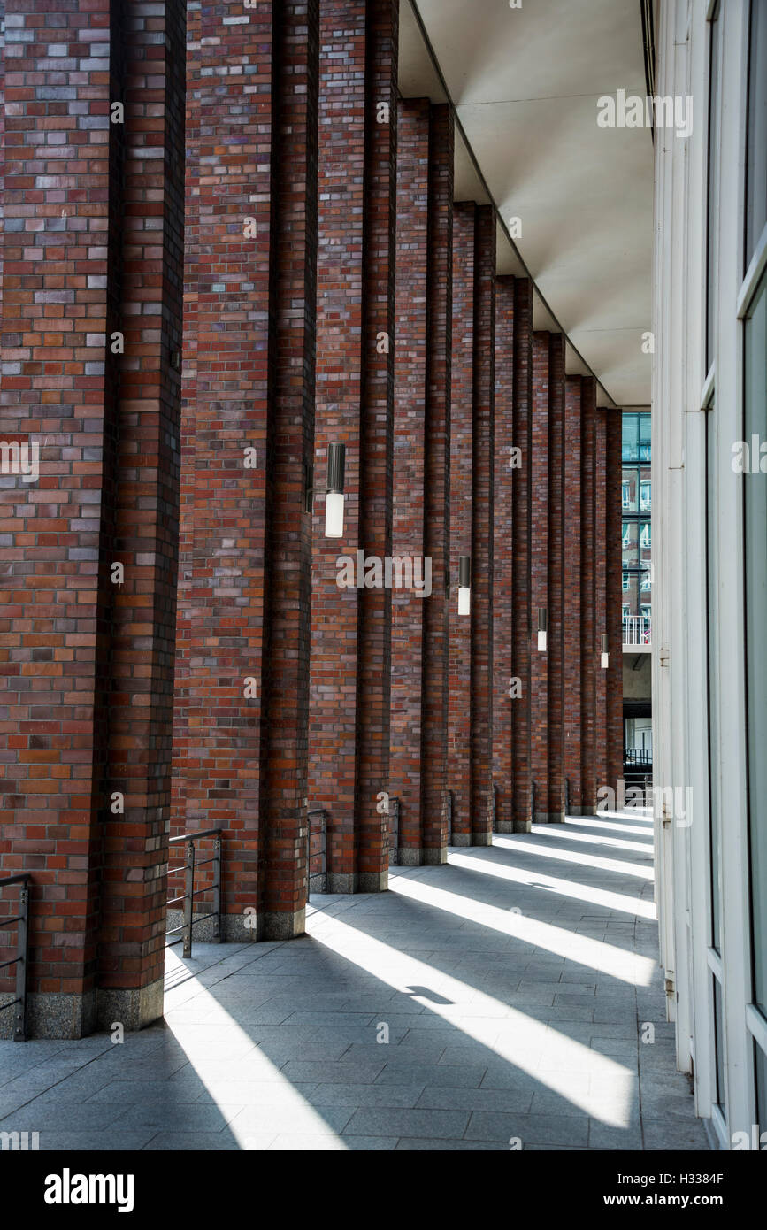 Hafencity, corridor with columns of brick, long shadows, Hamburg, Germany Stock Photo