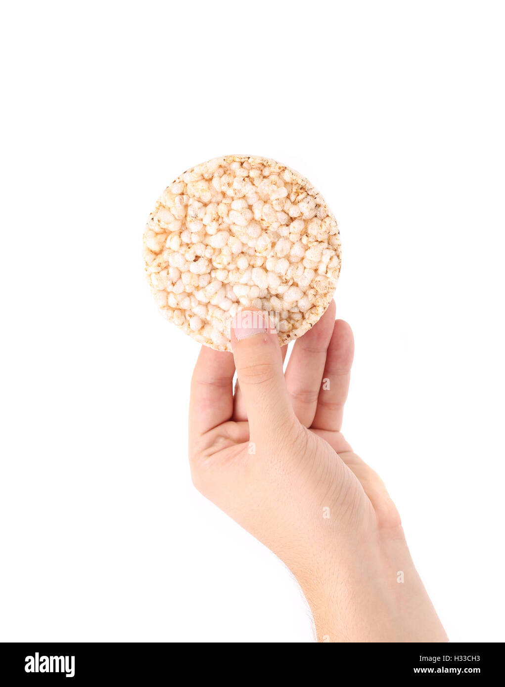 Hand holds rice cake Stock Photo Alamy