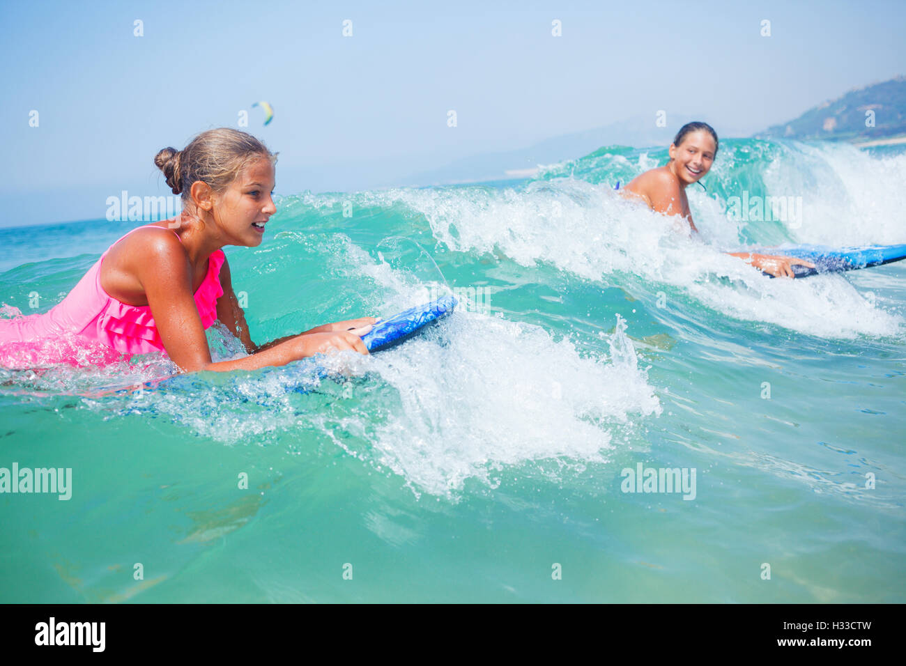 Summer vacation - surfer girls. Stock Photo