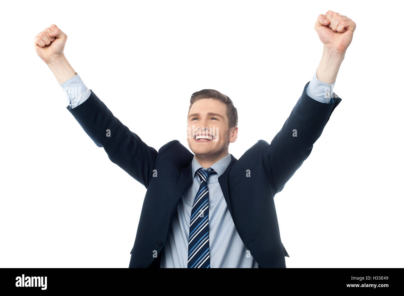Businessman celebrating success with arms up Stock Photo - Alamy