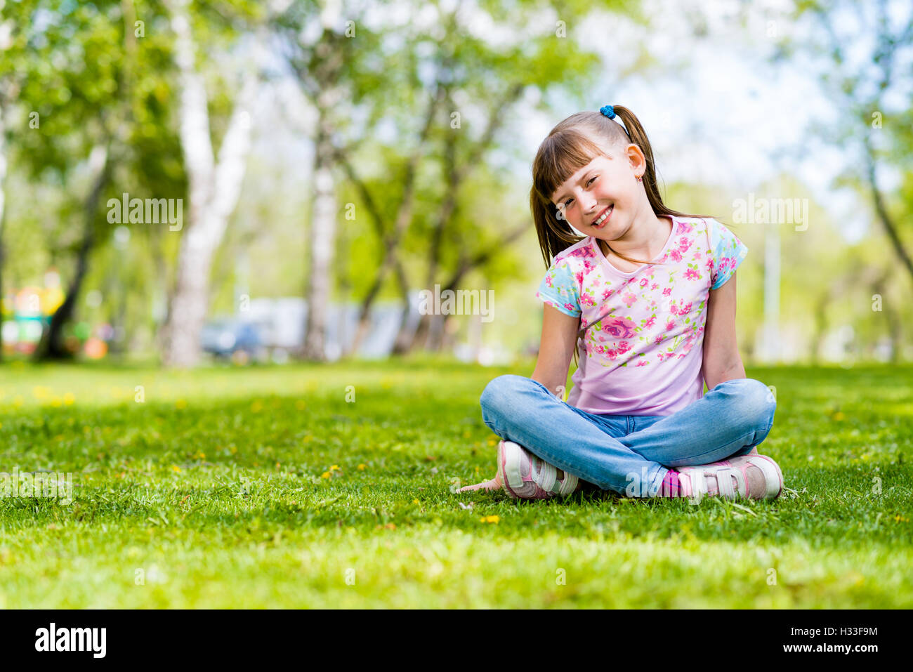 portrait of a girl in a park Stock Photo - Alamy