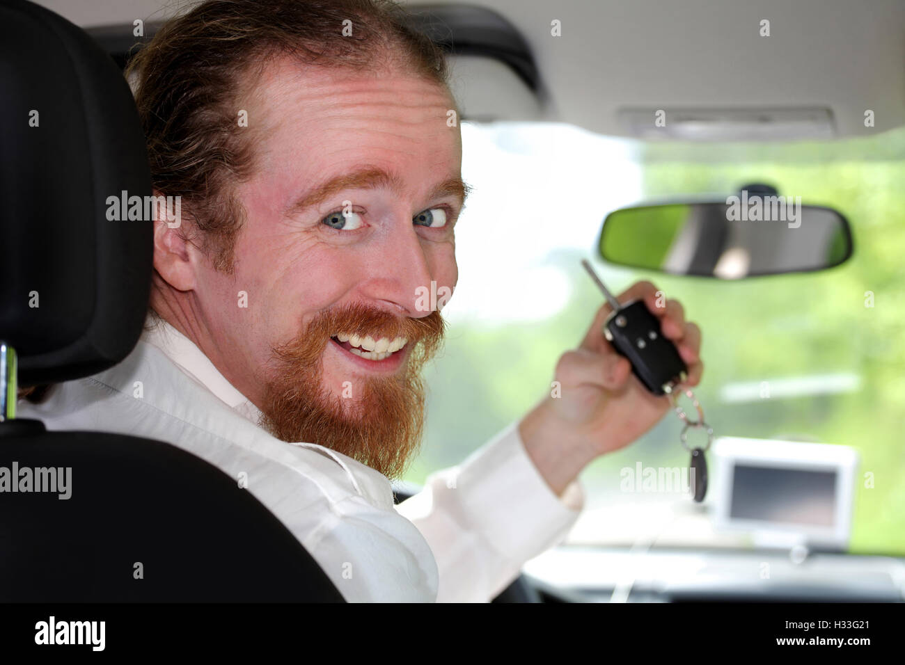 driver smiling sitting in car and showing new car keys Stock Photo - Alamy